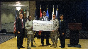 In January, Pohlmann (l); Lt. Col. Vanetta Kilpatrick, USAF (2nd from l); Jeffrey Lucas (c); and Joyce Jenkins-Hardin (r), chapter vice president for education, present Master Sgt. Juan Gonzalez, USAF, with a $1,500 scholarship for his continuing education.